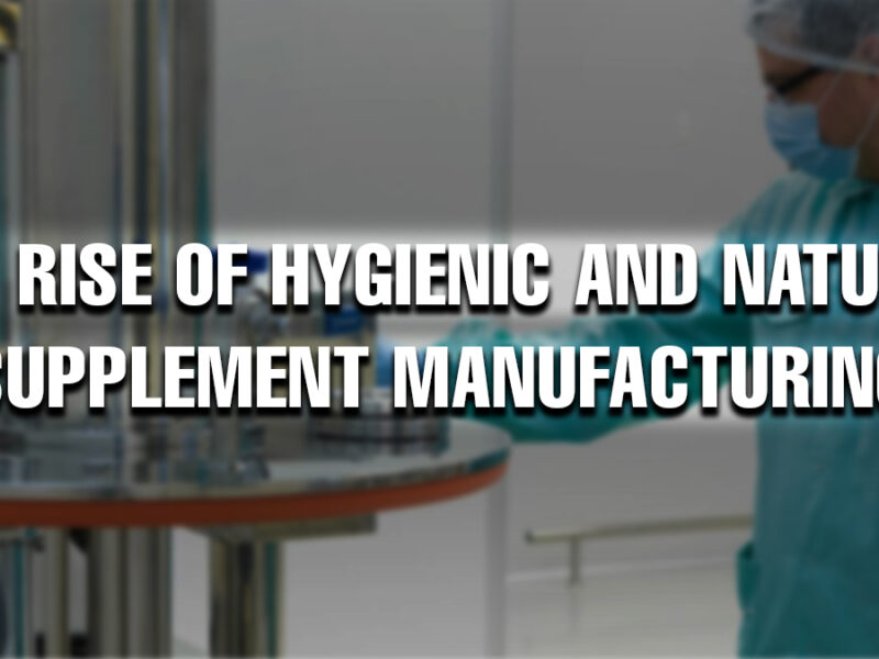 A person in cleanroom attire operating a machine in a sterile supplement manufacturing facility. The text overlay reads: “The Rise of Hygienic and Natural Supplement Manufacturing.
